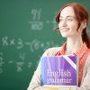 Red-haired English teacher feeling thoughtful before lesson